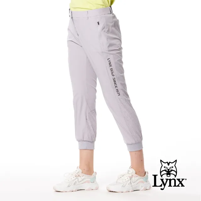 【Lynx Golf】首爾高桿風格！女款彈性舒適素面LOGO織帶剪接設計拉鍊口袋羅紋縮口窄管九分褲(二色)