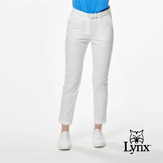 【Lynx Golf】女款彈性舒適極簡風格LOGO壓紋織帶剪接俏皮袋蓋矽膠標造型窄管九分褲(二色)