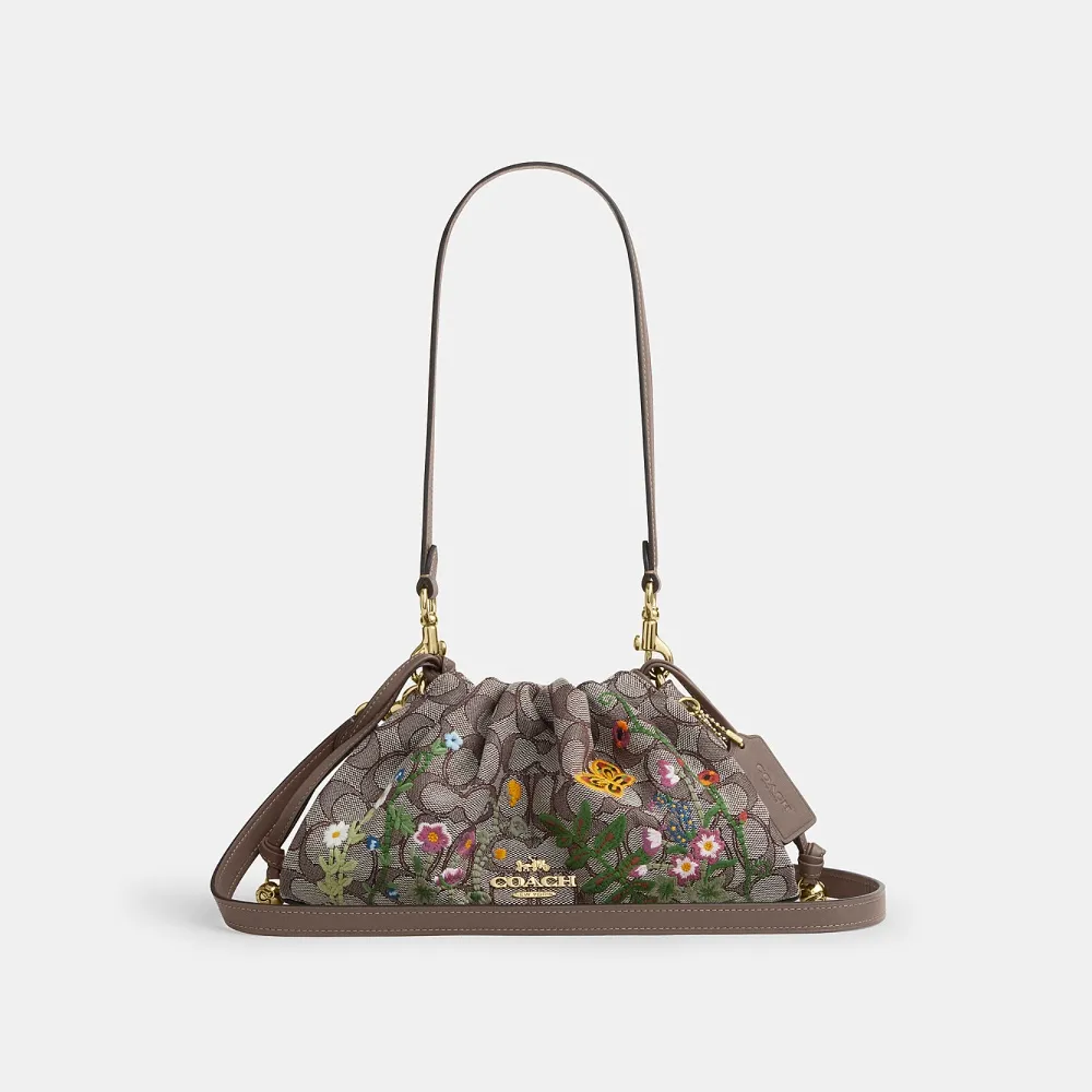 【COACH】蔻馳官方直營 FAYE 花卉刺繡單肩手袋 肩背包 拉繩包 斜背包(CDZ02)