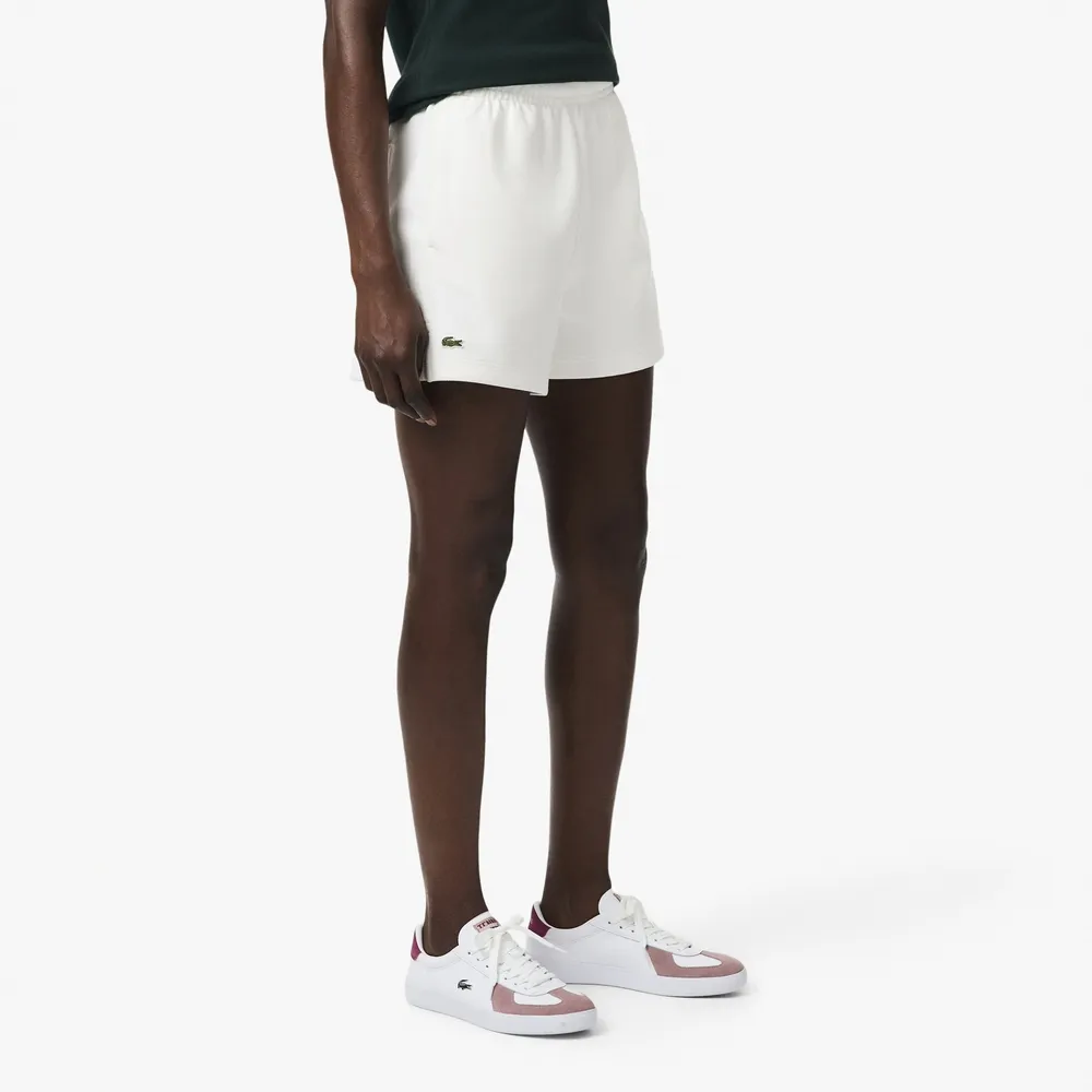 【LACOSTE】女款-優雅小開衩網眼布料休閒短褲(白色)